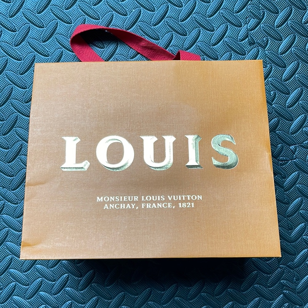 Louis Vuitton paper bag.